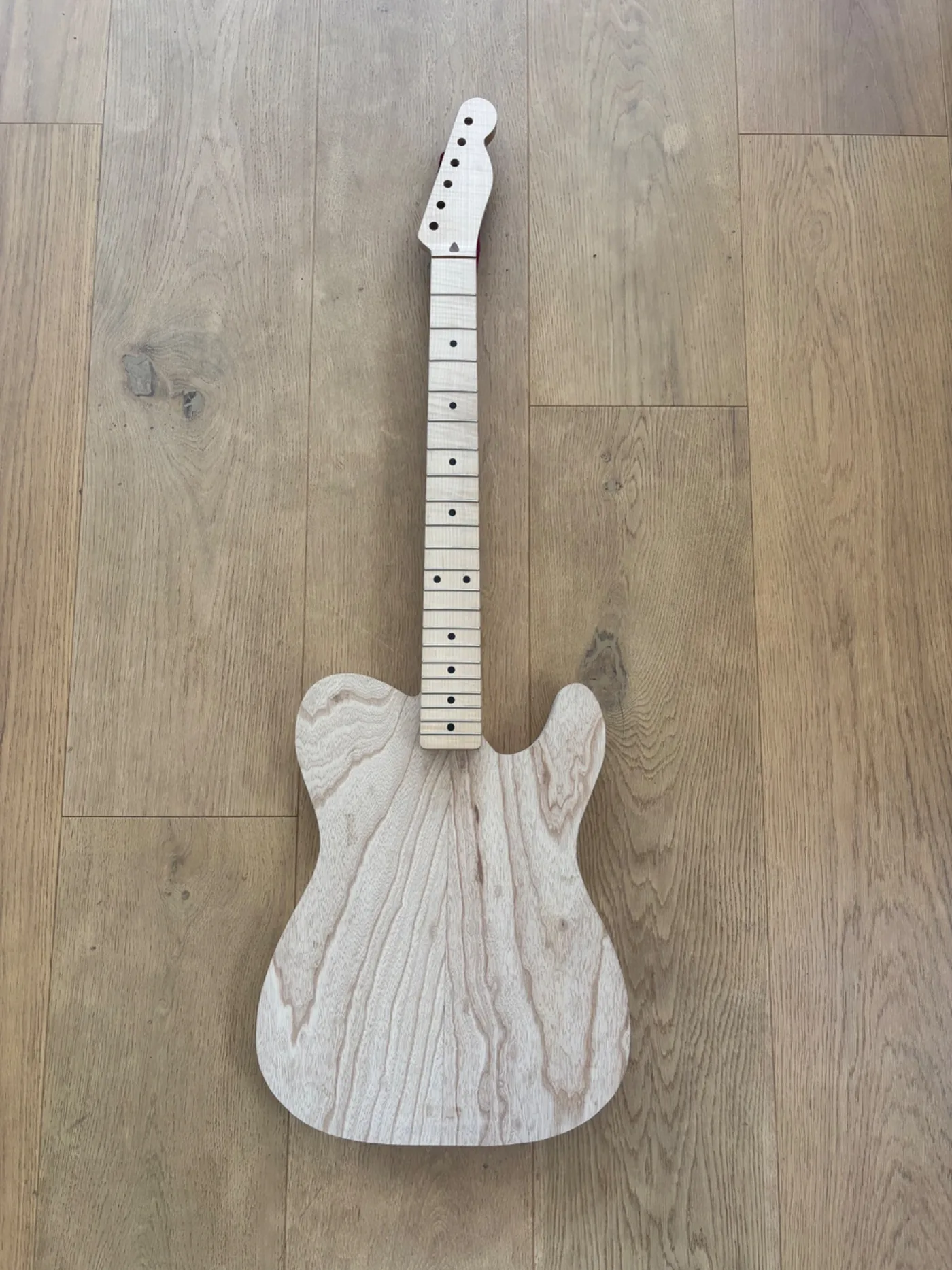 Creamy in-progress Tupelo guitar front view.