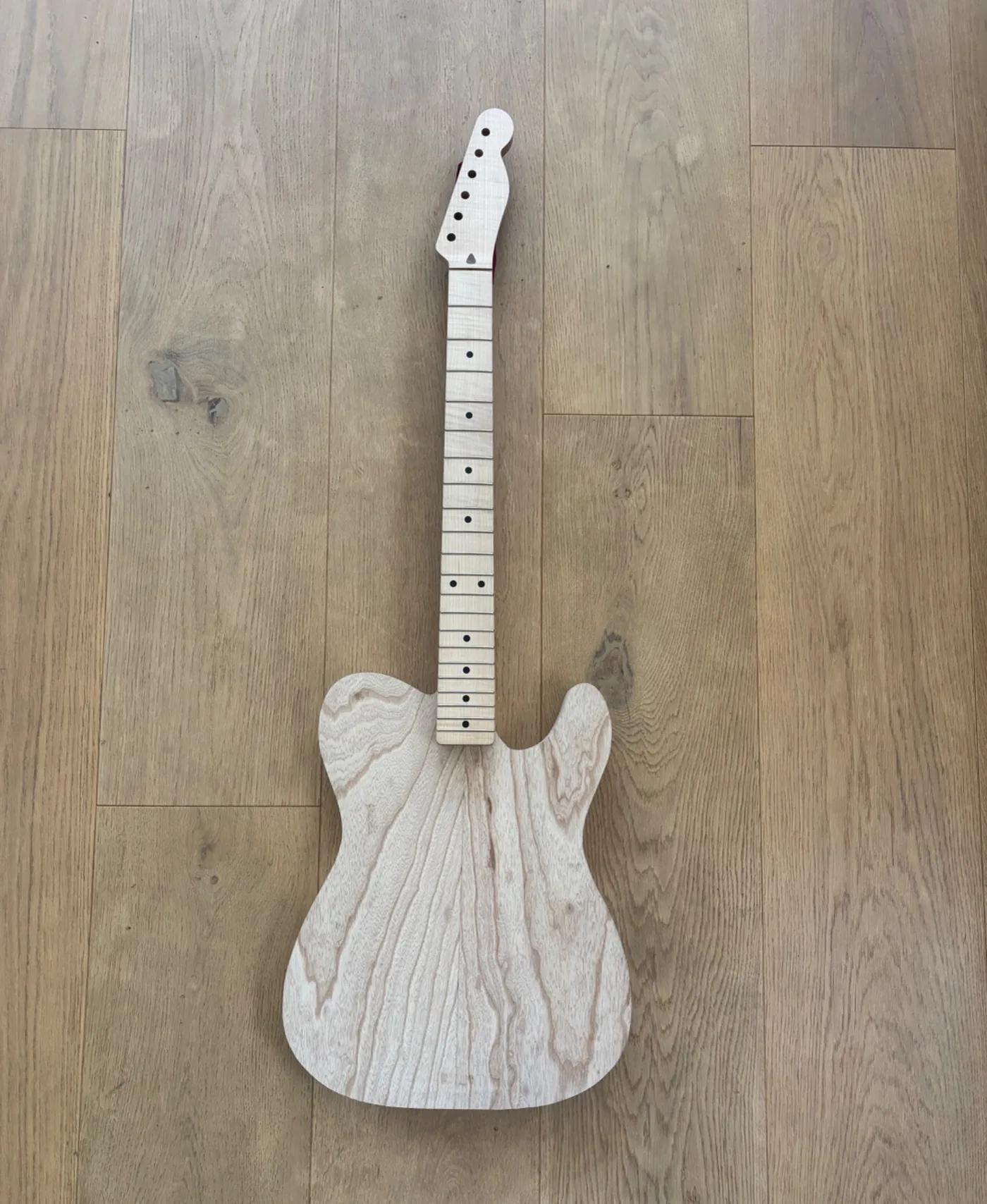 Creamy in-progress Tupelo guitar.