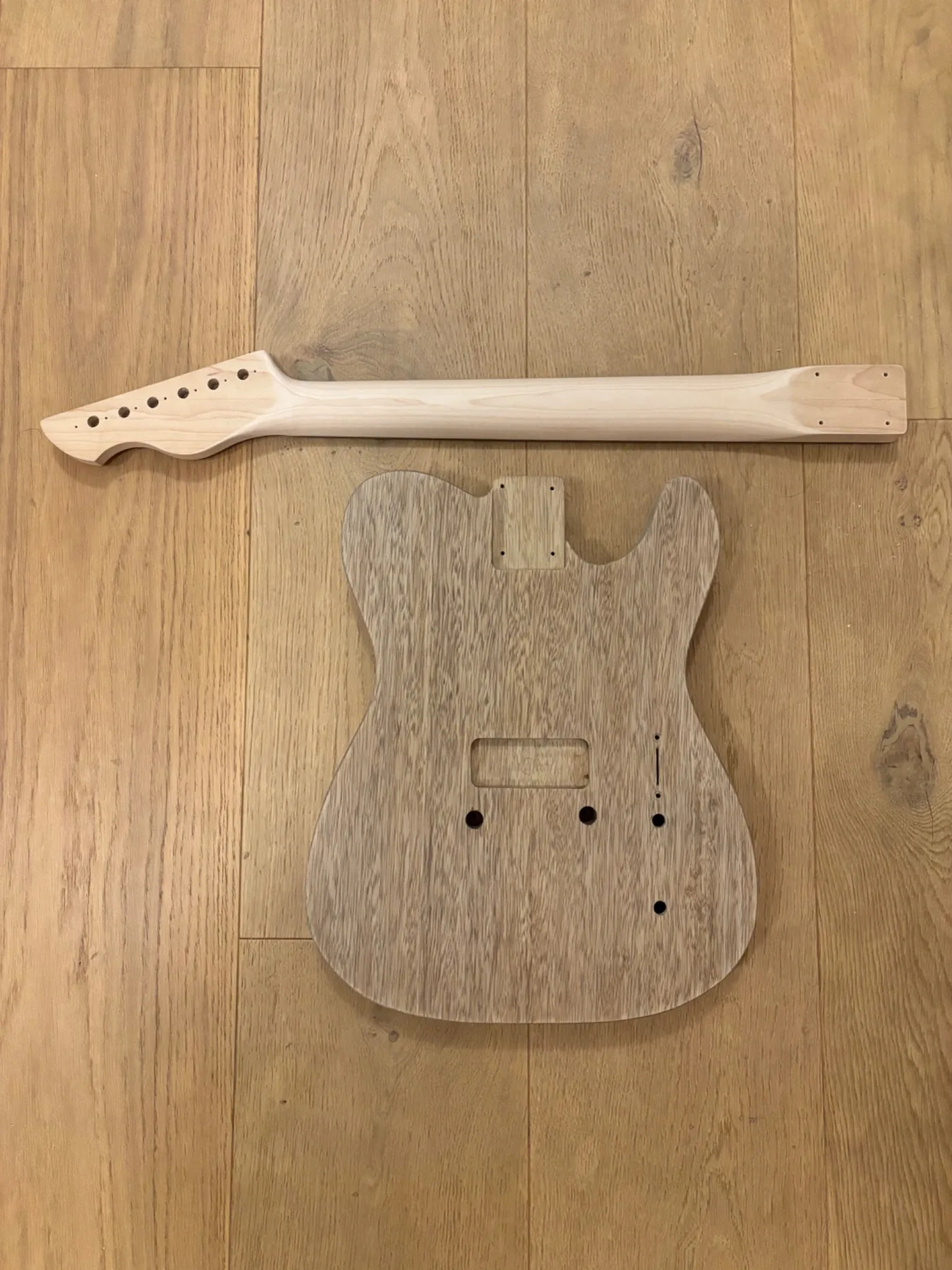 Plume body and neck laid out before final assembly.